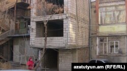 Armenia - a building constructed in front of the entrance of a block 