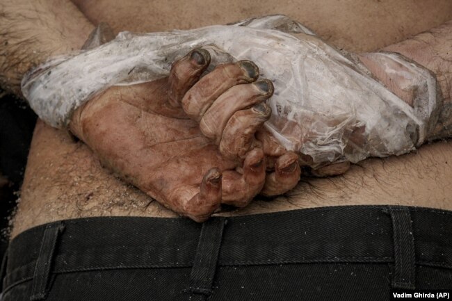The body of a Ukrainian man -- one of many -- who was found shot dead in Bucha with his hands tied behind his back.