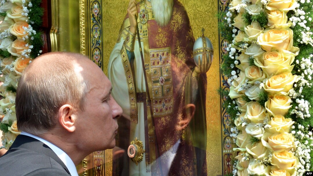 Russian President Vladimir Putin kisses an icon during a service and ceremony in Kyiv on July 27 to celebrate the 1,025th anniversary of Christianity in Ukraine and Russia. 