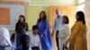 Britian's Prince William and Catherine, Duchess of Cambridge, visit a school classroom during a trip to Islamabad Pakistan on October 15.