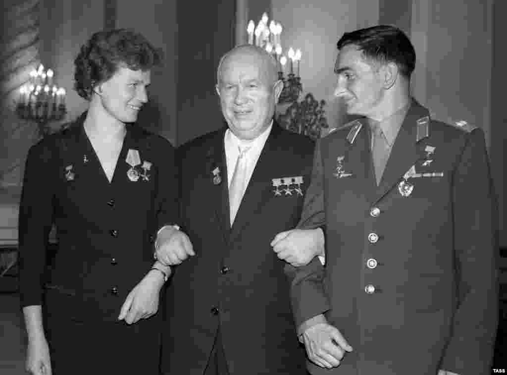 Soviet leader Nikita Khrushchev (center) with Tereshkova and cosmonaut Valery Bykovsky in 1963. Bykovsky holds the endurance record for a solo space flight. He spent five days in orbit.