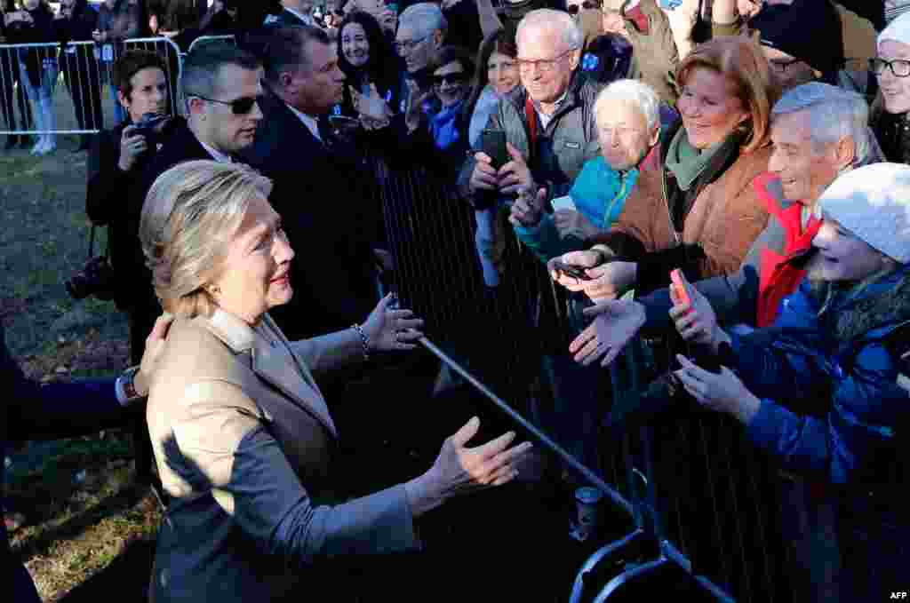 Democratic presidential nominee Hillary Clinton greets supporters after casting her vote near her home in Chappaqua, not far from New York City.