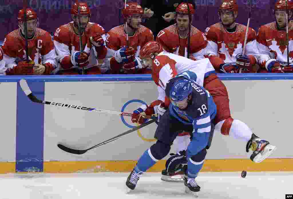 Finland&#39;s Sami Lepisto (bottom) stops Russia&#39;s Alexander Ovechkin during the men&#39;s ice hockey quarterfinal match that saw the host country eliminated 3-1. (AFP/Alexander Nemenov)
