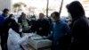 An Iranian lab official registers people for coronavirus testing outside a lab in Tehran on March 9.