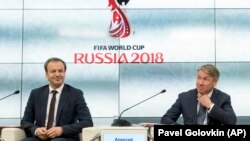 Deputy Prime Minister Arkady Dvorkovich (left) and Aleksei Sorokin, Local Organizing Committee CEO of the Russia 2018 World Cup, attend a news conference on the environmental and economic impact of the tournament in Moscow on April 25.