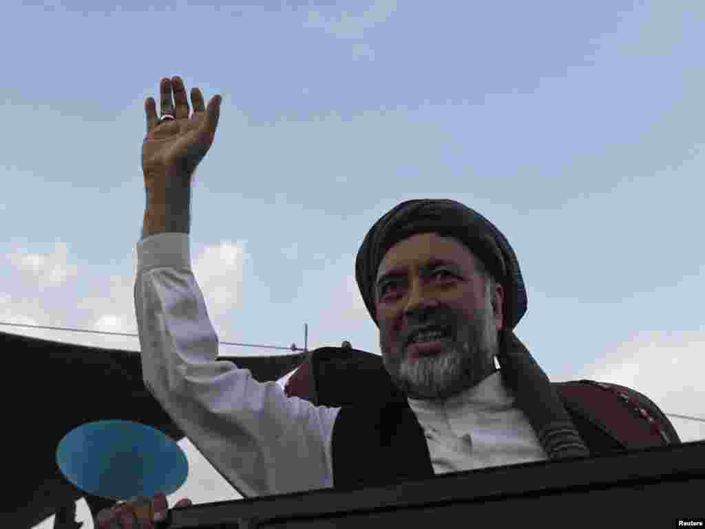 The campaign has attracted a much larger field of candidates than the 2005 parliamentary polls. Haji Mohammad Mohaqiq, an ethnic Hazara member of parliament, waves to supporters as he leaves a campaign rally in Jabar Khan, west of Kabul.