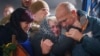 Relatives of a fallen Ukrainian serviceman cry during his funeral ceremony at a crematorium in Kyiv on November 8. 