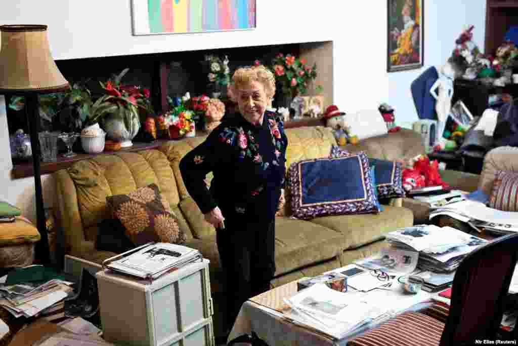 Jona Laks is a survivor of SS doctor Josef Mengele&#39;s twins experiments at the Auschwitz concentration camp. In this photo she stands at the living room in her house in Tel Aviv, Israel January 21, 2020. This week she made the trip the Auschwitz death camp in Oswiecim, Poland, from her home in Israel with her granddaughter, Lee Aldar, 28.