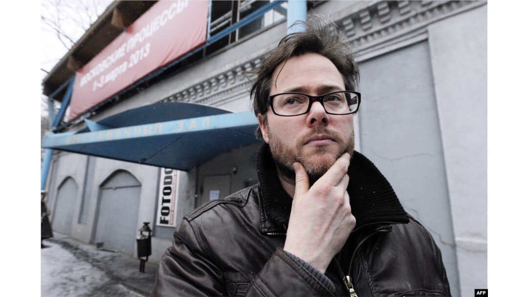 Swiss director Milo Rau stands outside the Sakharov Center.