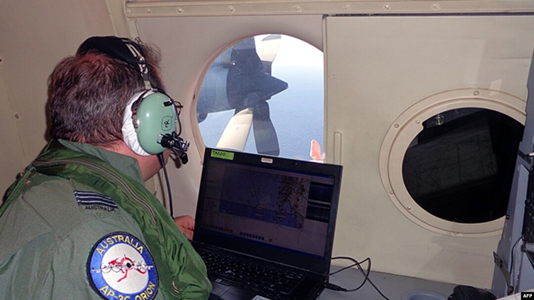 A crew member of an Australian maritime patrol aircraft involved in the search operation for Malaysian Airlines Flight MH370