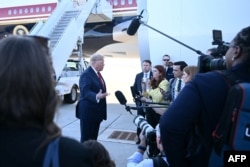 US President Donald Trump speaks to the press upon arriving in Charlotte, North Carolina, on September 16.