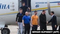 Joy And Tears As Freed Prisoners Arrive In Kyiv, Moscow 