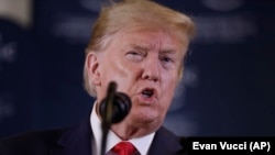 U.S. President Donald Trump speaks during a news conference at the World Economic Forum in Davos on January 22.