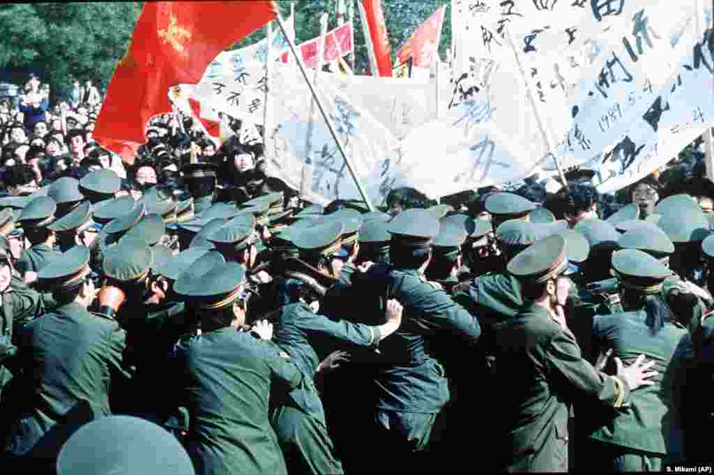 Student Demonstrations China, Tiananmen Square, 1989---Chinese police try in vain to contain a huge crowd of student marchers during a pro-reform demonstration in Beijing, China, May 4 1989. (AP Photo/S. Mikami)