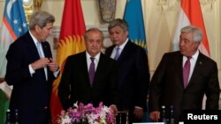 (L-R) U.S. Secretary of State John Kerry and foreign ministers Abdulaziz Kamilov of Uzbekistan, Erlan Abdyldaev of Kyrgyzstan and Erlan Idrissov of Kazakhstan arrive at the Central Asia Ministerial at the Department of State in Washington on August 3.