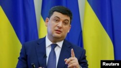 Ukrainian Prime Minister Volodymyr Hroysman gestures during a news conference in Kyiv on April 11.