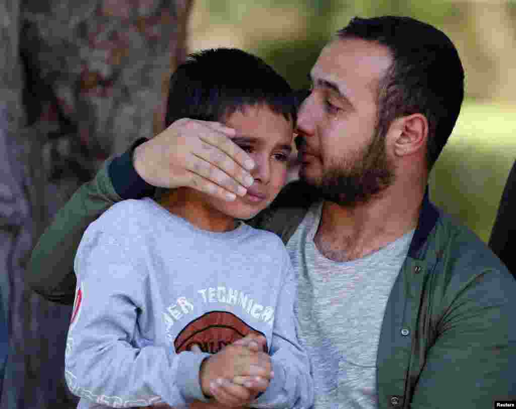 Ten-year-old Mustafa, son of Afghan reporter and translator Zabihullah Tamanna, mourns for his father during a ceremony at a military hospital in Kabul. Tamanna, a 38-year-old father of three, was killed on June 5 alongside veteran American photojournalist David Gilkey in a Taliban ambush in southern Helmand Province. (Reuters/Omar Sobhani)