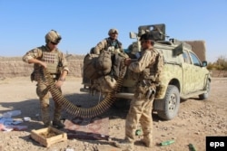 Afghan soliders sorting ammunition during an operation against Taliban militants in Soor Guder district of Helmand province in November.