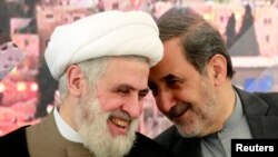 Ali Akbar Velayati (R), Iran's Supreme Leader Ayatollah Ali Khamenei's top advisor on international affairs, talks with Lebanon's Hezbollah deputy leader Sheikh Naim Qassem. File photo