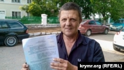 Валерий Большаков с текстом приговора, 10 июня 2019 года