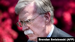 US -- National Security Advisor John Bolton listens to a question while speaking with reporters about Venezuela outside the West Wing of the White House April 30, 2019, in Washington, DC. (Photo by Brendan Smialowski / AFP)