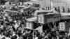 Mourners carry coffins through the streets of Tehran during a mass funeral for the victims aboard Iran Air Flight 655, which was shot down by the USS Vincennes in the Persian Gulf, July 7, 1988. Iran claims the shooting down of a passenger plane was act o