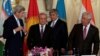 (L-R) U.S. Secretary of State John Kerry and foreign ministers Abdulaziz Kamilov of Uzbekistan, Erlan Abdyldaev of Kyrgyzstan and Erlan Idrissov of Kazakhstan arrive at the Central Asia Ministerial at the Department of State in Washington on August 3.