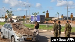 A car is covered in dirt apparently kicked up by a rocket impact in Tel Aviv. The photo was taken on the morning of October 2 after Iran launched a massive rocket attack on Israel the previous day.&nbsp;