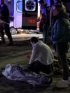 Emergency services and volunteers evacuate the injured and the dead after the Russian shelling of the town of Sumy in Ukraine