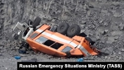 Police said the bus turned over and fell down a 10-meter drop near the town of Mezhdurechensk. 