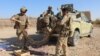 Afghan soldiers shown sorting ammunition during an operation against Taliban militants in Soor Guder district of Helmand in November 2016.