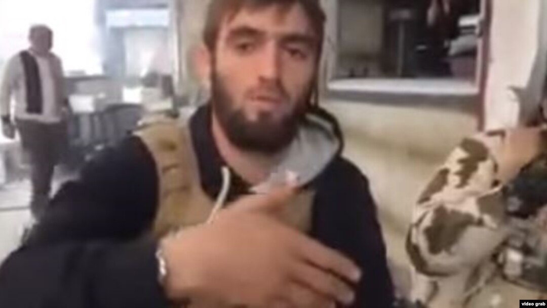 A screen grab from the video purporting to show Azerbaijani Fariz Dostaliyev enjoying a meal while fighting with Islamic State (IS) in Syria.