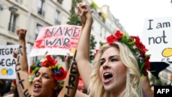 Activists from the Ukrainian women movement Femen protest against anti women's politic near the official Femen Centre opening today in Paris, 18Sep2012
