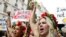 Activists from the Ukrainian women movement Femen protest against anti women's politic near the official Femen Centre opening today in Paris, 18Sep2012