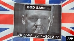 A portrait of Wikileaks founder Julian Assange is taped to a Union Flag outside the Supreme Court in central London in May.