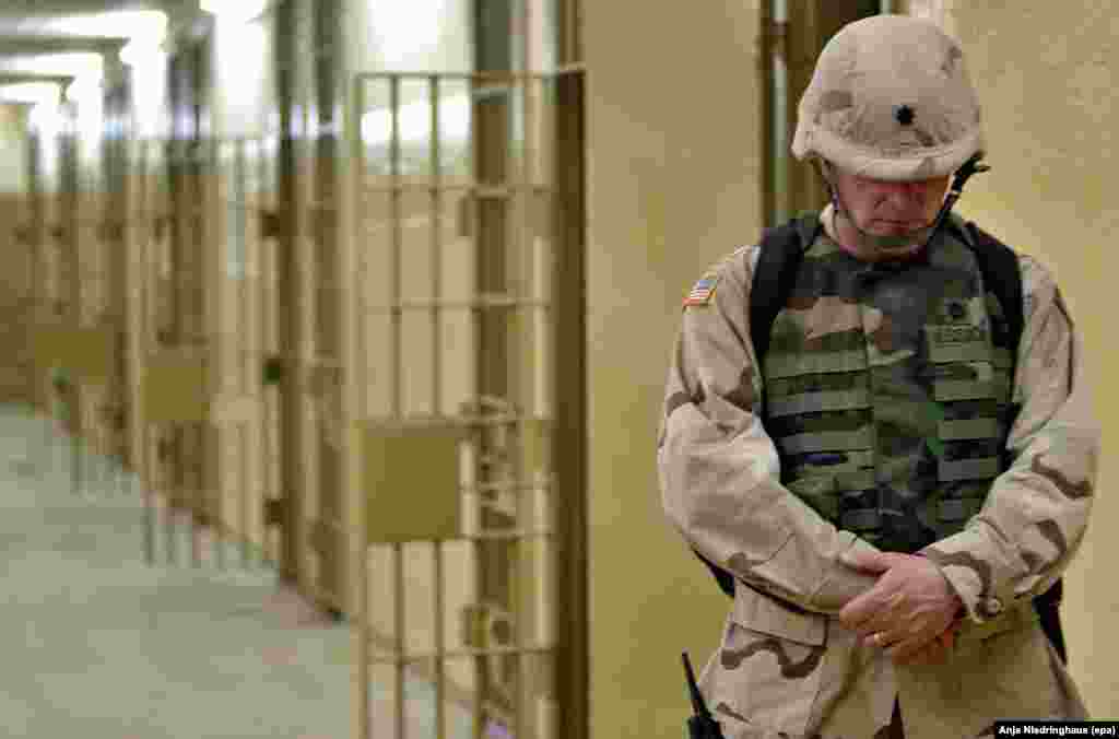 A U.S. soldier walks through the halls of the Abu Ghraib prison&nbsp;outside Baghdad, Iraq, on May 5, 2004.