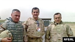 General Zaza Gogava (left) visiting Georgian troops in Iraq this summer