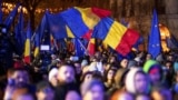 ROMANIA – People wave Romanian and European Union flags during a pro-European rally ahead of the country's Dec. 8 runoff presidential elections in Bucharest, Romania, December 5, 2024 