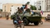 A Russian armored personnel carrier is seen driving on the streets of Banqui late last year. The Central African government's security forces have been backed by a 12,000-strong UN peacekeeping contingent as well as hundreds of Russian and Rwandan paramilitaries and soldiers in the country's civil war.