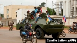 A Russian armored personnel carrier is seen driving in the street during the delivery of armored vehicles to the Central African Republic's army in Bangui in October 2020.