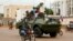 A Russian armored personnel carrier drives in the street during the delivery of armored vehicles to the Central African Republic army in Bangui in 2020.