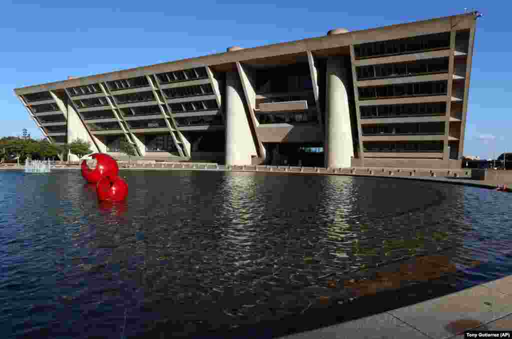 U.S. -- A reflecting pool sits in a large plaza on the walk up to Dallas City Hall, a building designed by architect I.M. Pei, in Dallas, May 16, 2019