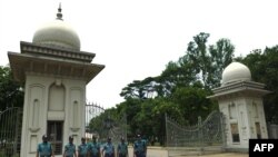 Bangladeshi police personnel stand guard at the Supreme Court premises in Dhaka on May 11.