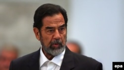 Saddam Hussein addresses the court during his trial in Baghdad in November 2006