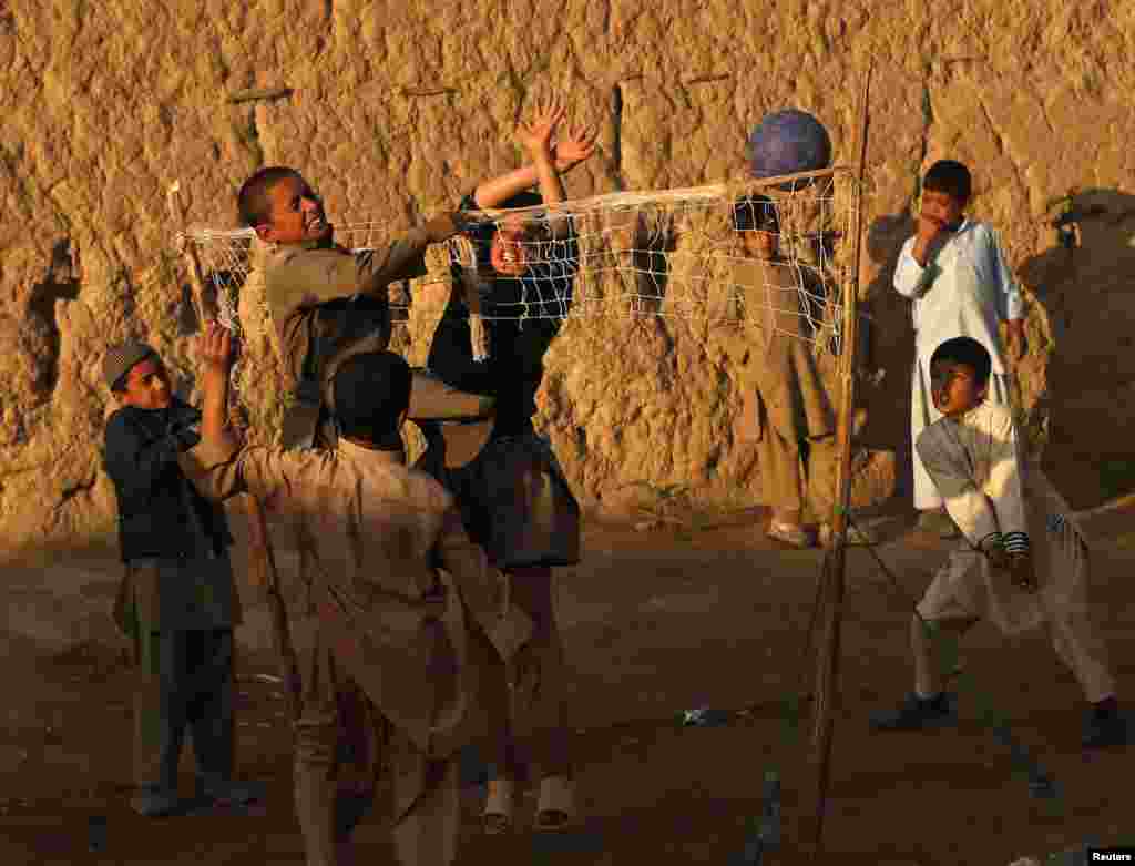 Afghan boys play volleyball on the outskirts of Kabul. (Reuters/Mohammad Ismail) 