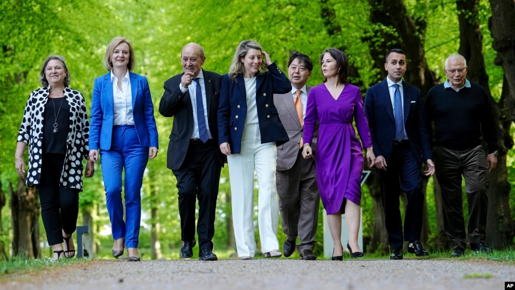 (From left) Victoria Nuland, U.S. undersecretary of state, U.K. Foreign Minister Elizabeth Truss, French Foreign Minister Jean-Yves Le Drian, Canadian Foreign Minister Melanie Joly, Japanese Foreign Minister Hayashi Yoshimasa, German Foreign Minister Annalena Baerbock, Italian Foreign Minister Luigi Di Maio, and EU foreign policy chief Josep Borrell take a walk at the G7 meeting in the German resort of Weissenhaus on May 12. 