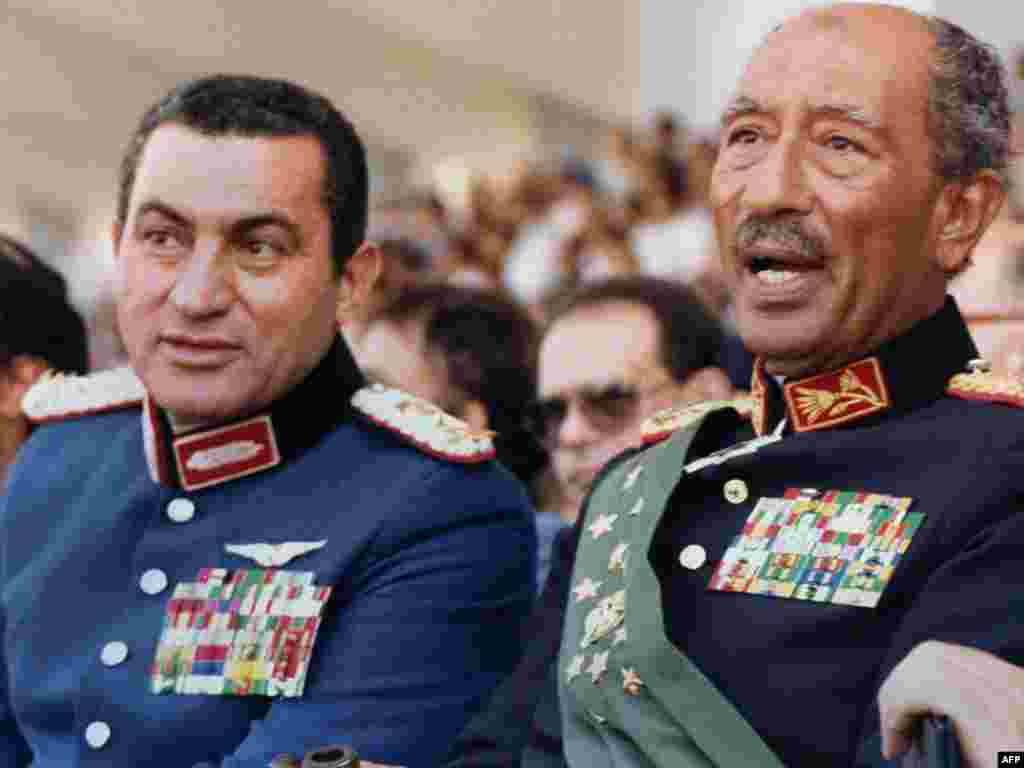 Egyptian vice president at the time, Mubarak with the late President Anwar Sadat. - Both dressed in military honor uniforms, Mubarak and Sadat attend a military parade on October 6, 1981, in Cairo during which Sadat was assassinated by a group of Islamist fundamentalists.