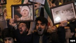 Protesters shout slogans against Russia for its alleged role in a chemical attack in Syria near the Russian Consulate in Istanbul on April 4.