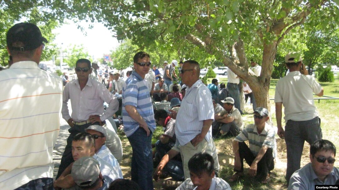 Kazakh oil workers picket the Manghystau regional administration office in Aqtau on June 2.