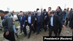 Iranian President Hassan Rohani visits Golestan Province after the recent flooding on March 27.